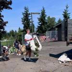 Mercer Island High School football player Axel Avenstam (forefront) joins his teammates in a school field cleanup day on Aug. 1. Courtesy photo