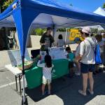 Mercer Islands Kate deStwolinski provides sun safety education at her Summer Celebration booth last month. Courtesy photo