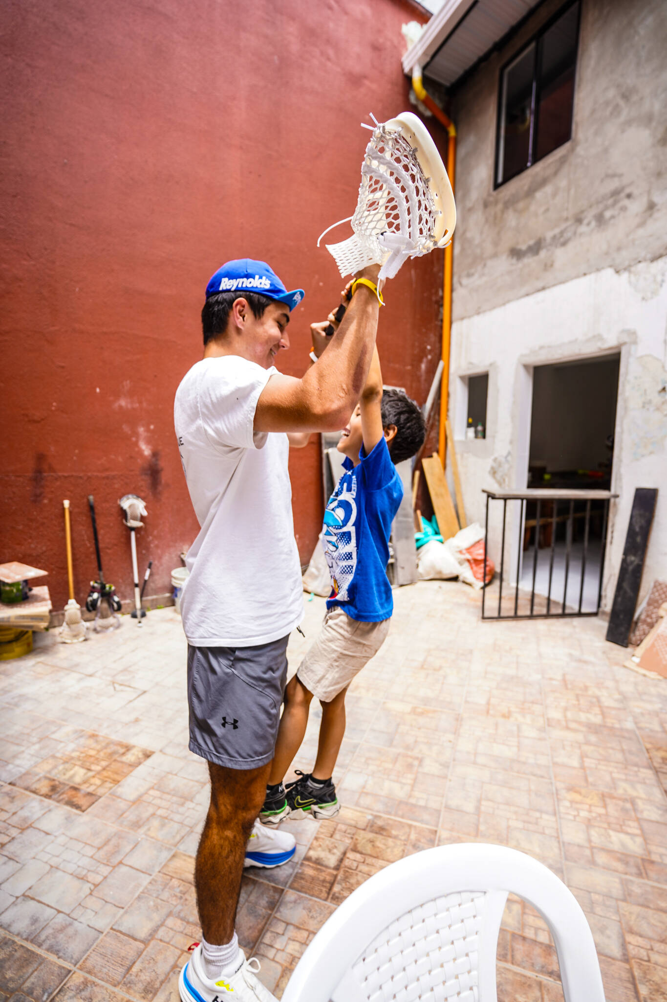 A Mercer Island Lacrosse Club player interacts with a child during a trip to Medellín, Colombia, in August. Photo courtesy of Dylan Ryan