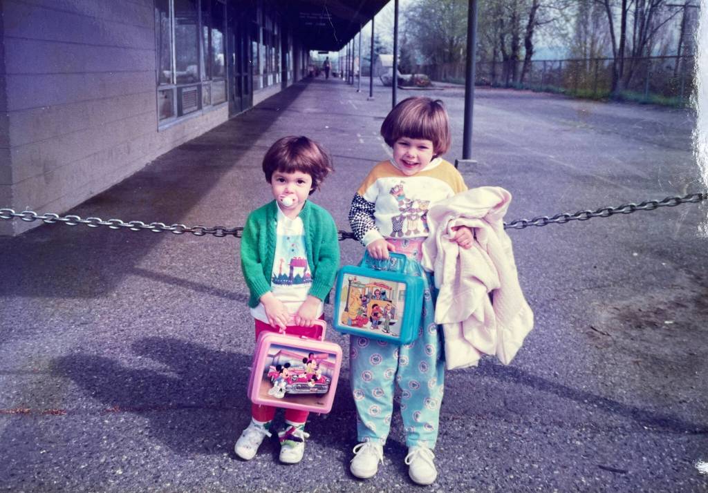 Current Pixie Hill Board Vice President Caitlin McHugh as a child with her little sister, Emma McHugh, on the first day of school at Pixie Hill in the fall of 1990. Courtesy photo