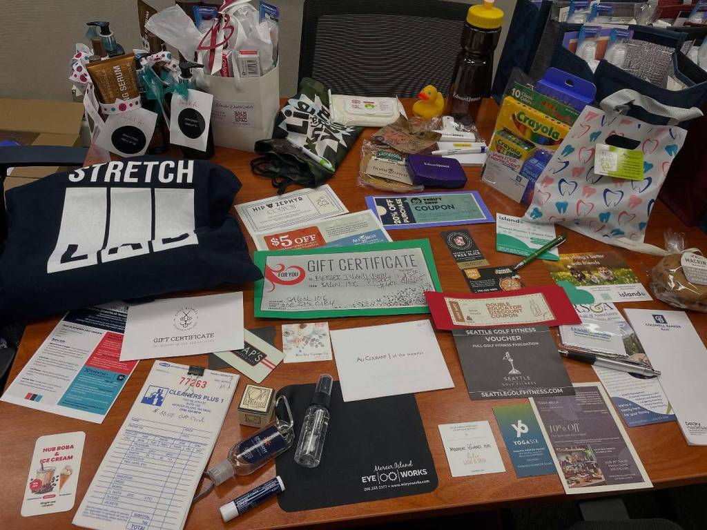 A host of Mercer Island organizations provided items for the Mercer Island School Districts new staff welcome bags. They are: Epiphany, MI Eyeworks, Island Hospital, Dr. York and Dr. Novak, Dr. Judy, S.R. Schill and Associates, Homegrown, Stretch Lab, Perry K Studio, Lice Knowing You, Hip Zephyr, All the Best, Blue Iris Vintage (Carnation business), Dulce Lash and Skin, Terra Bella, Barrels, Pagliacci, Sahara Pizza, Mercer Island Thrift Shop, Edward Jones, LParis, Mio Posto, Viviennes Bistro, Yoga Six, Coldwell Banker, Macrina Bakery, Newcastle Fruit, Produce, and Garden (Newcastle business), Puppy Bubbles, Haps, AuCourant, Cleaners Plus, Seattle Golf Fitness, Salon 106, Riviera Maya and HubBoba and Ice Cream. Photo courtesy of the Mercer Island School District