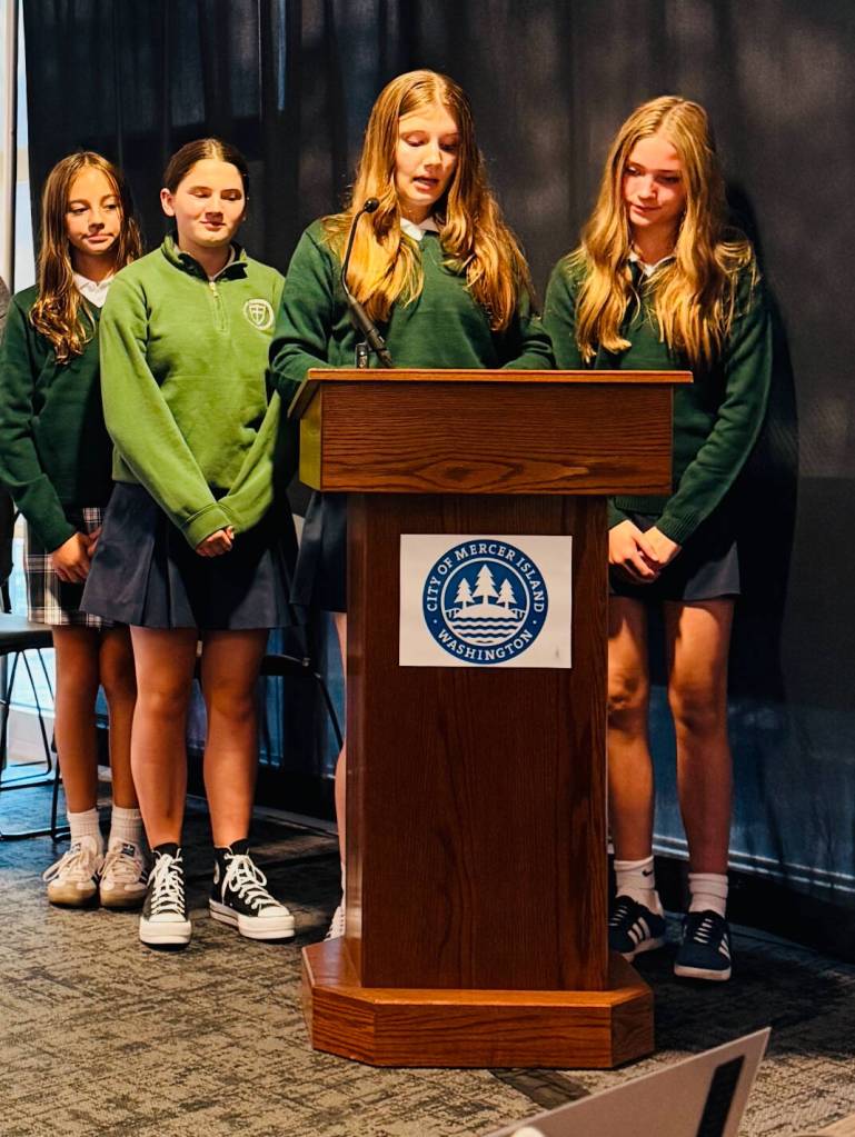 St. Monica Middle School students (left to right) Vivienne Street, Valerie Hay, Cara King and Hunter Lippens at the Mercer Island City Council meeting. Courtesy photo