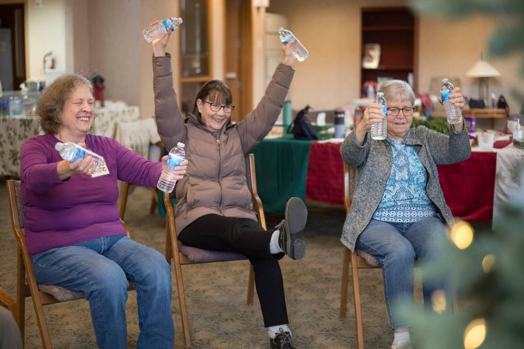 Old Friends Club participants engage in Victorious Water Bottle Weight Training. Photo courtesy of Tanya Su