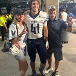 Villanova University football player Garrett Rogan stands with his mom Kelly and dad Paul after the teams road game versus Penn State University on Sept. 13. Courtesy photo