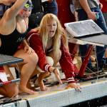 Mercer Island High School junior Emma Morelli and senior Maya Moncaster cheer on their teammates. Photo courtesy of Kara Lucas