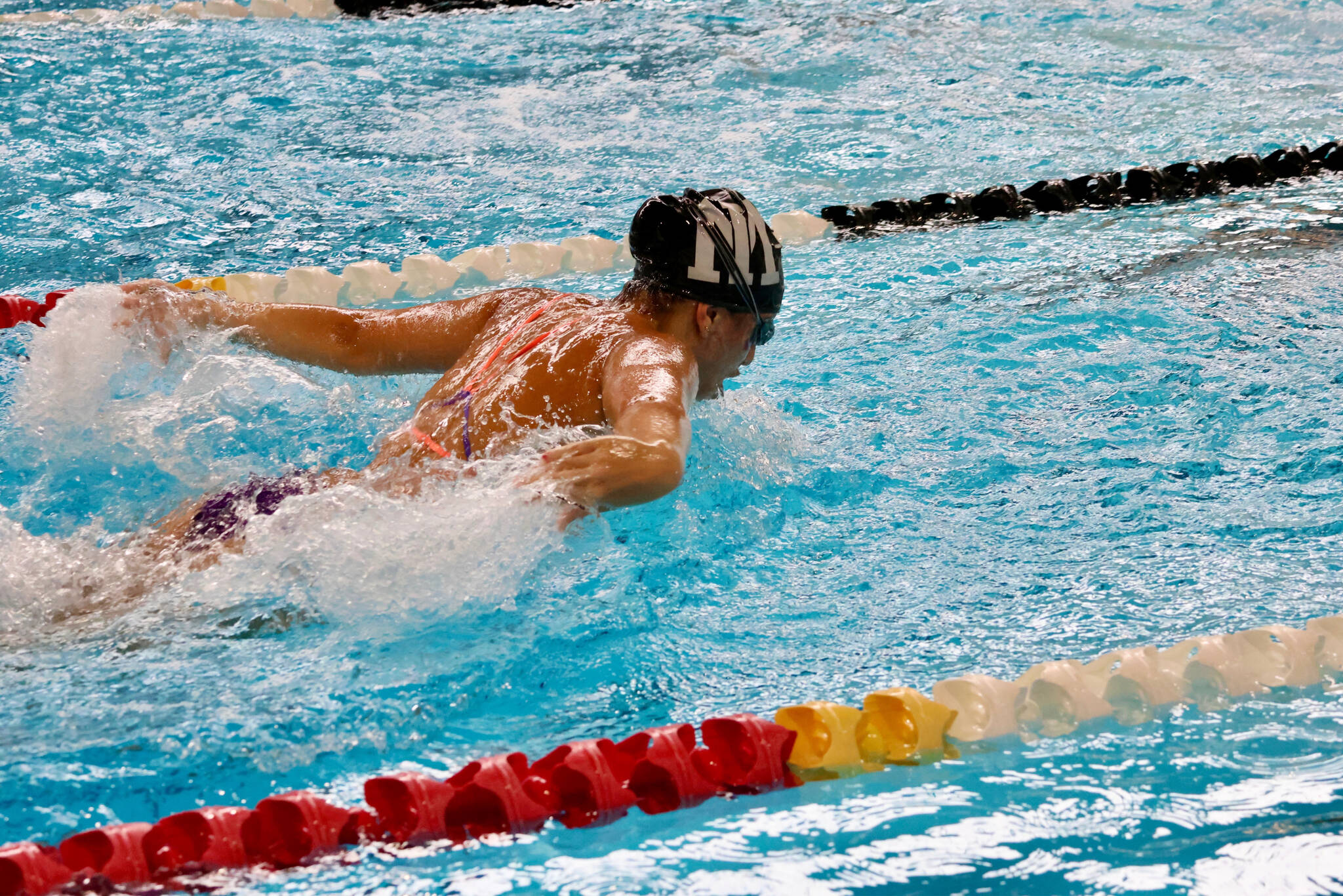 Mercer Island High School sophomore Mira Waingold swims the butterfly. Photo courtesy of Kara Lucas