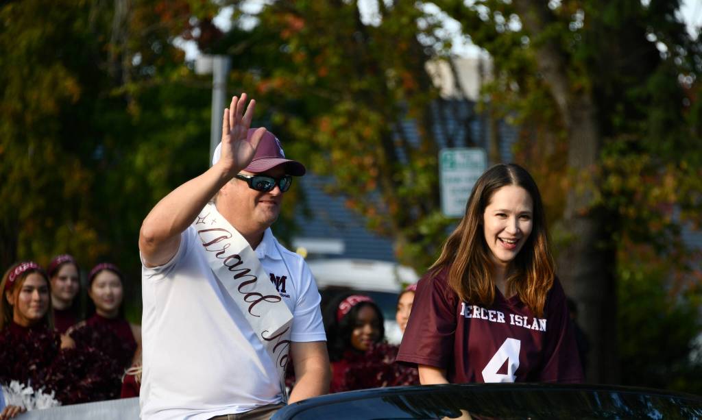 Mercer Island High Schools Homecoming Parade generated plenty of smiles on the evening of Sept. 26 along 86th Avenue Southeast and Southeast 42nd Street. Leading the parade were MIHS instructor Tyson Peters, who was voted grand marshal by the student leadership, and MIHS instructor Alma Parness, who was voted staff royal by the student body. Andy Nystrom/ staff photo
