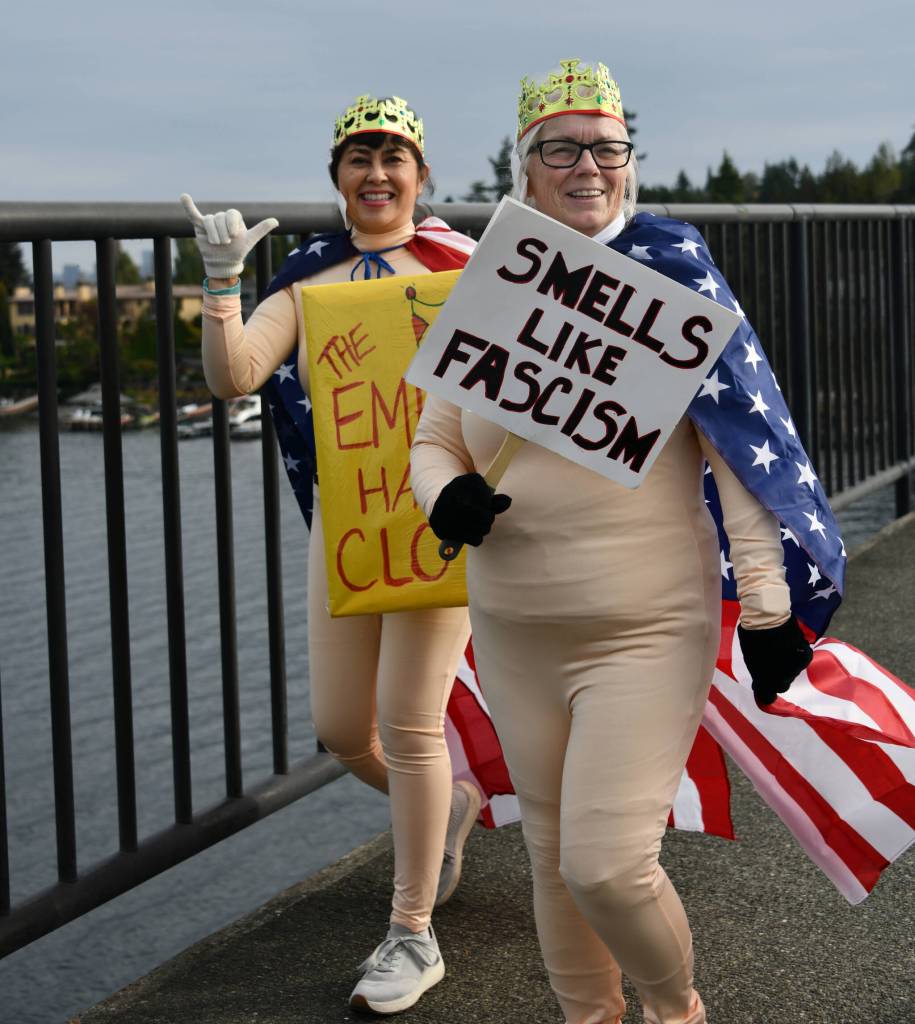 Mercer Island No Kings March participants walk across the Interstate 90 bridge coming from Aubrey Davis Park on Mercer Island on the morning of Oct. 18. In a press release, noting that more than 1,100 people attended the march, organizer Gene Robertson said protesters were peaceful and the mood was happy. It was a powerful celebration of love of country and rejection of authoritarian overreach. Passing cars honked in support, and cyclists were patient, the release added. According to the No Kings website: On October 18, more than 7 million of us rose up at more than 2,700 events in all 50 states, DC, and cities worldwide to say: America has no kings, and the power belongs to the people. The thousands of nationwide events are against President Donald Trumps policies and actions. Mercer Island High School students Magnus and Shay said this was their first protest, and expressed concerns about unlawful cuts to science, and 100% misuse of the military. Mercer Island resident Lora Ford said, We are losing democracy bit by bit, and its important that we dont get used to it. She noted that her ancestors came on the Mayflower, So Im an immigrant! Andy Nystrom/ staff photo
