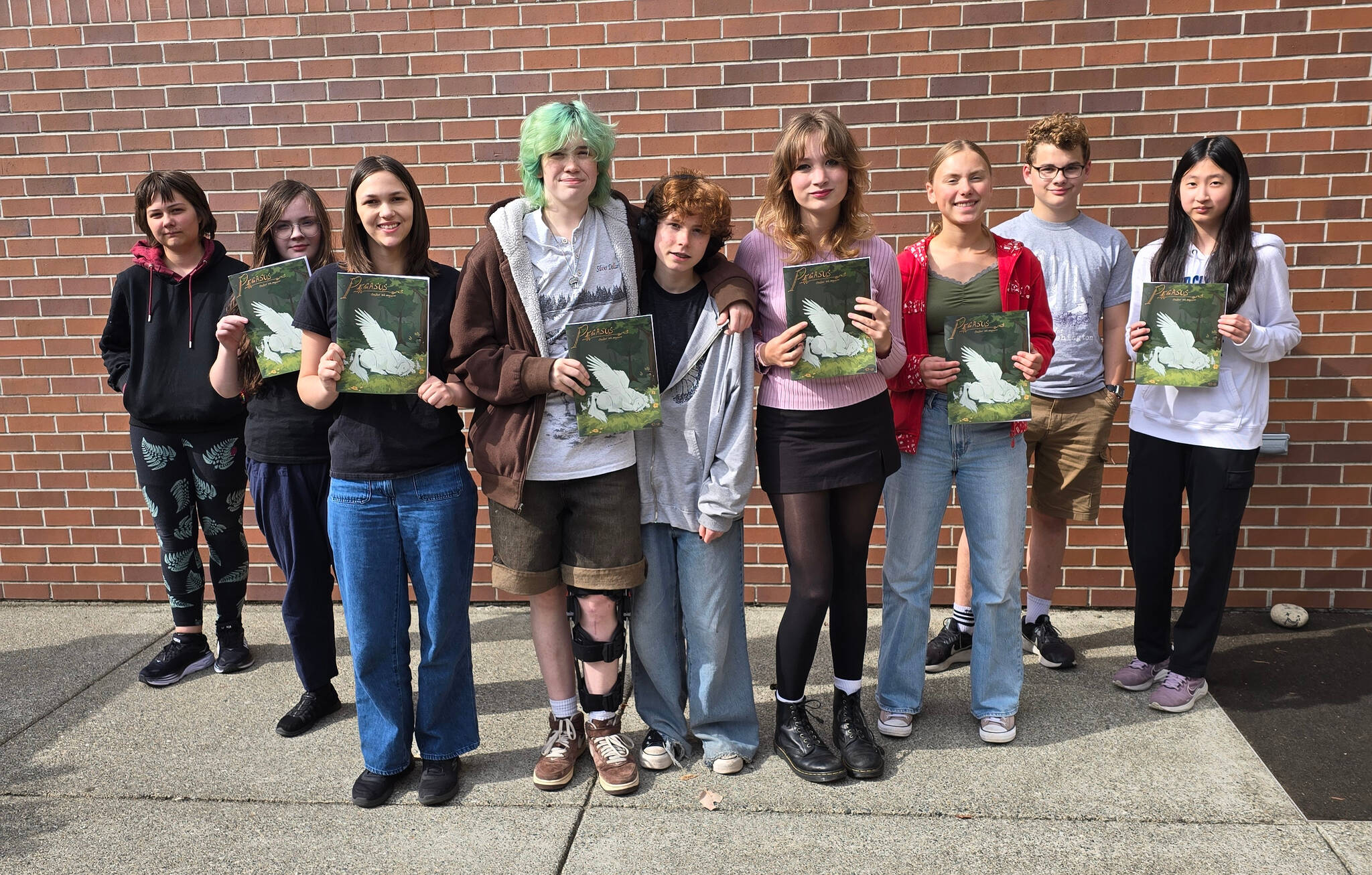 From left to right: Kitt Furukawa, Lola Joinson, Tessa Baumgarten, Millie Farmer-Clark, Clove Fields, Cordelia Tangeman, Layla Petricek, Quinn Nelson and Kaitlyn Chu. This is a mix of Pegasus staff from last year and this year as well as students in the creative writing and publishing class. Courtesy photo