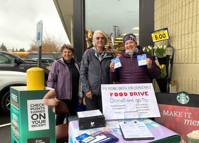 Mercer Island Rising United for Democracy hosted a food and grocery store gift card drive in response to the federal government withholding SNAP funding for two hours on Nov. 14. Generous shoppers at the north end QFC donated more than $1,330 and a carload of groceries and supplies. The gift cards went to Mercer Island Youth and Family Services food security programs, and the food and supplies were given to Hopelink on the Eastside. Pictured are Julie Sarkissian, Callie Ridolfi and Q Galazer. Courtesy photo