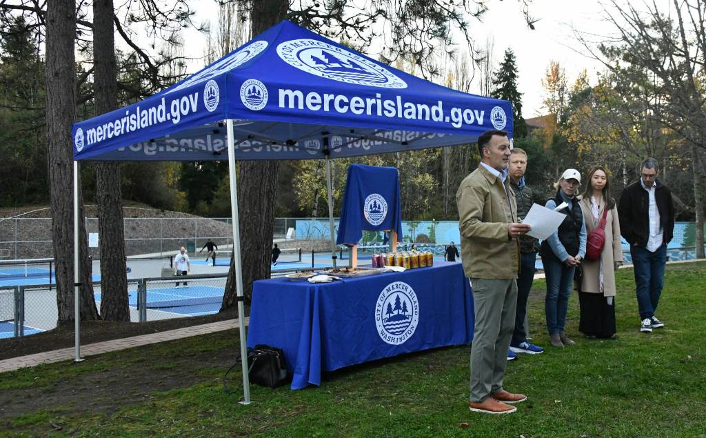 Mercer Island Mayor Salim Nice speaks as Deputy Mayor David Rosenbaum, councilmember Lisa Anderl, incoming councilmember Julie Hsieh and councilmember Daniel Becker listen at the Jake Jacobson Pickleball Courts dedication ceremony on Nov. 18 at Luther Burbank Park. Andy Nystrom/ staff photo