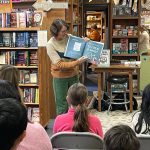 Author-illustrator Rachel Michelle Wilson reads to the crowd at Island Books on Nov. 19. Courtesy photo