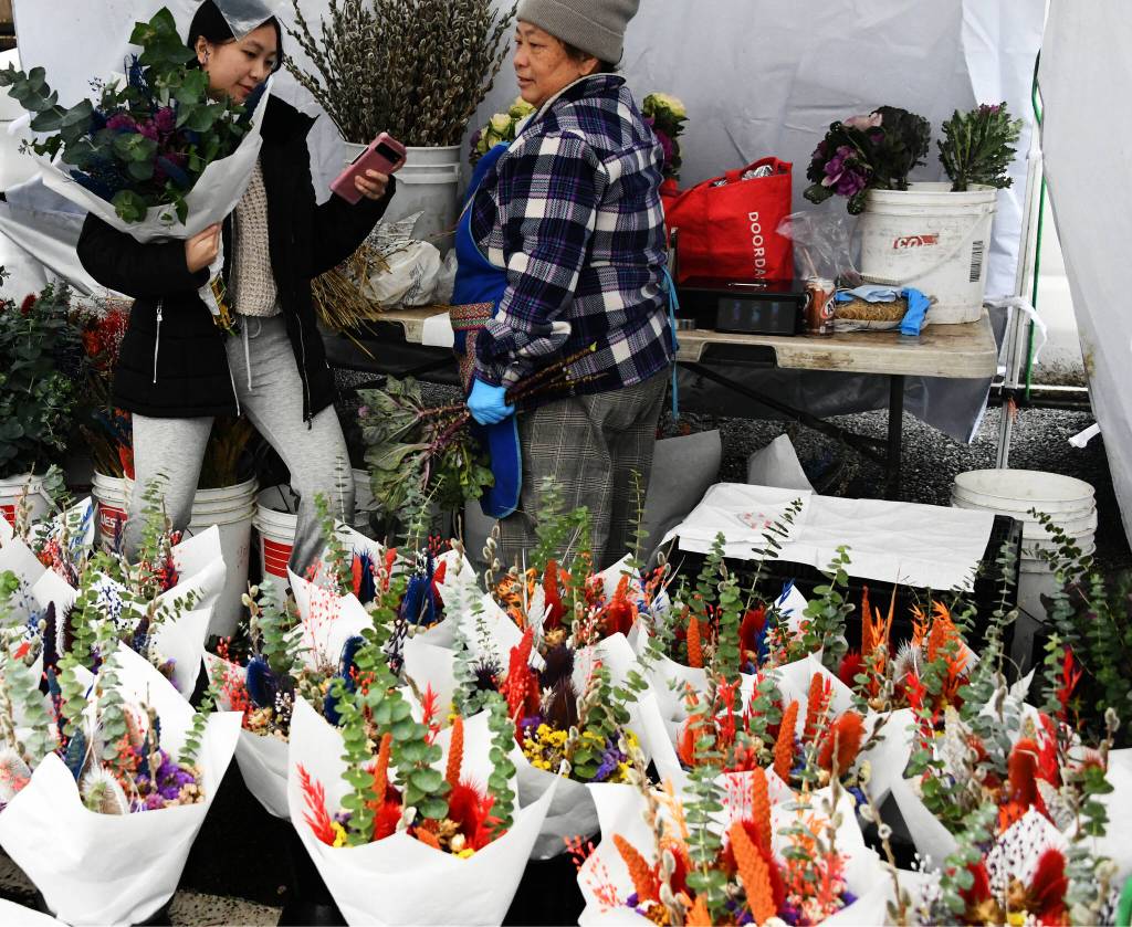 Flowers are all set for purchasing at the Harvest Market. Andy Nystrom/ staff photo