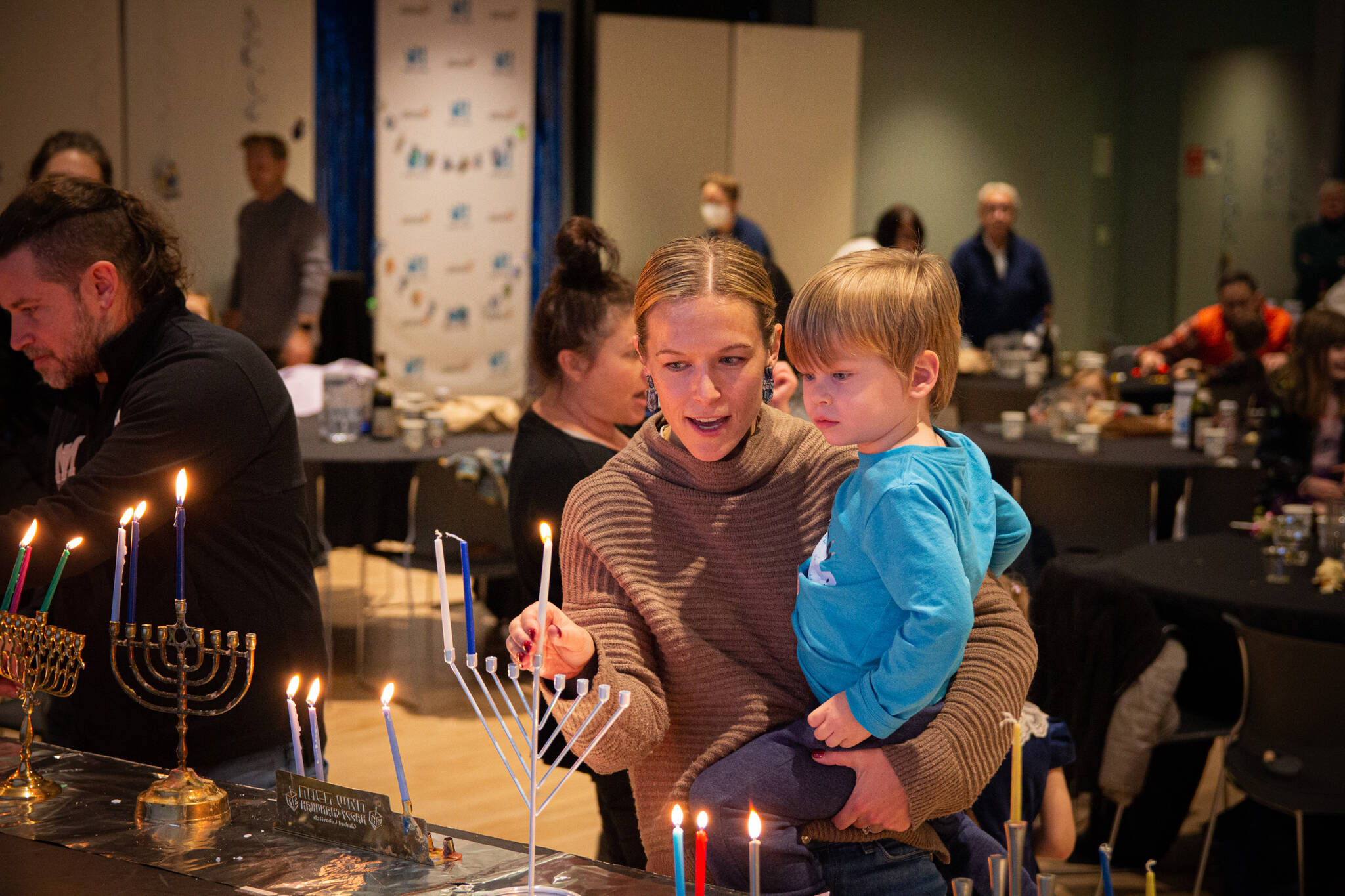 Attendees participate in a past Stroum Jewish Community Center Family Hanukkah Celebration. Photo courtesy of the SJCC