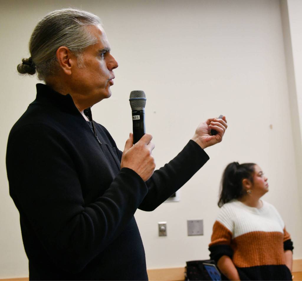 King County Sexual Assault Resource Center (KCSARC) Director of Prevention & Education Services Chris Johnson speaks at the Moving Beyond Stranger Danger: Personal Safety Conversations for Todays Youth program on Dec. 8 on Mercer Island. KCSARC prevention services specialist Jessica Cowles stands in the background. Andy Nystrom/ staff photo