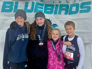Left to right: Serena Robinson, Beau Berry (11-12 girls 5th place), Ava Olmstead (7-8 girls 10th place) and Aksel Davidson. Courtesy photo