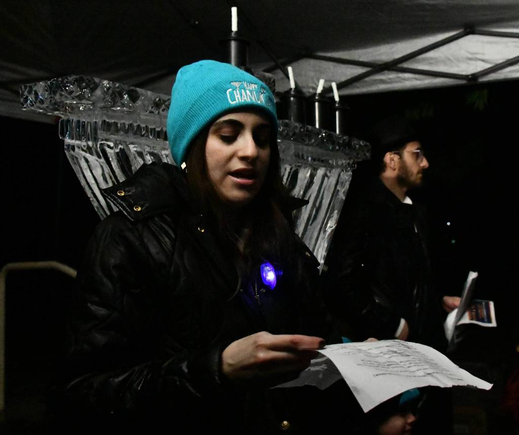 Mushka Kornfeld of Chabad Mercer Island speaks to the crowd at the menorah lighting. Andy Nystrom/ staff photo