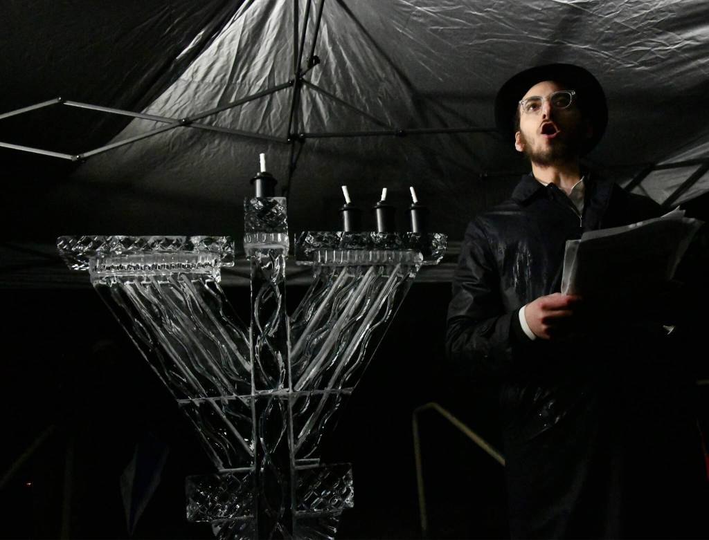Rabbi Nissan Kornfeld of Chabad Mercer Island unleashes a powerful speech at the menorah lighting. Andy Nystrom/ staff photo