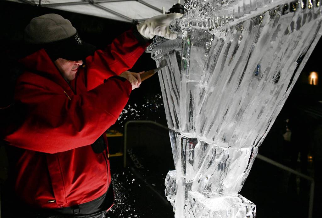 Tony Parker of Tonys Ice Creations sculpts the six-foot ice menorah. Andy Nystrom/ staff photo