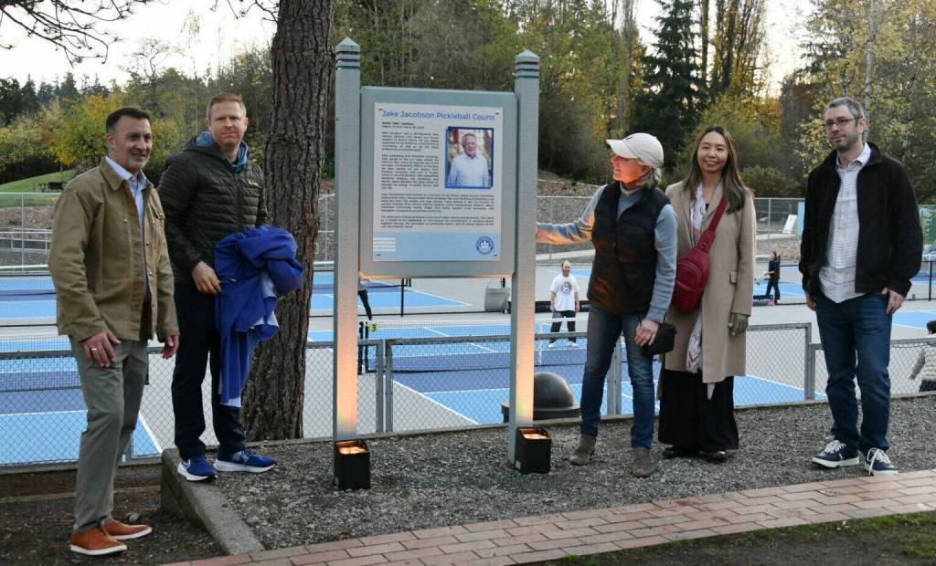 Mercer Island Mayor Salim Nice, Deputy Mayor David Rosenbaum, councilmember Lisa Anderl, incoming councilmember Julie Hsieh and councilmember Daniel Becker gather for a photo following the unveiling of the Jake Jacobson Pickleball Courts plaque on Nov. 18 at Luther Burbank Park. Andy Nystrom/ staff photo