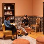 A cozy reading nook, featuring a curated selection of books, at the special exhibition Farm to Table: Art, Food, and Identity in the Age of Impressionism at Seattle Art Museum. Chloe Collyer photo