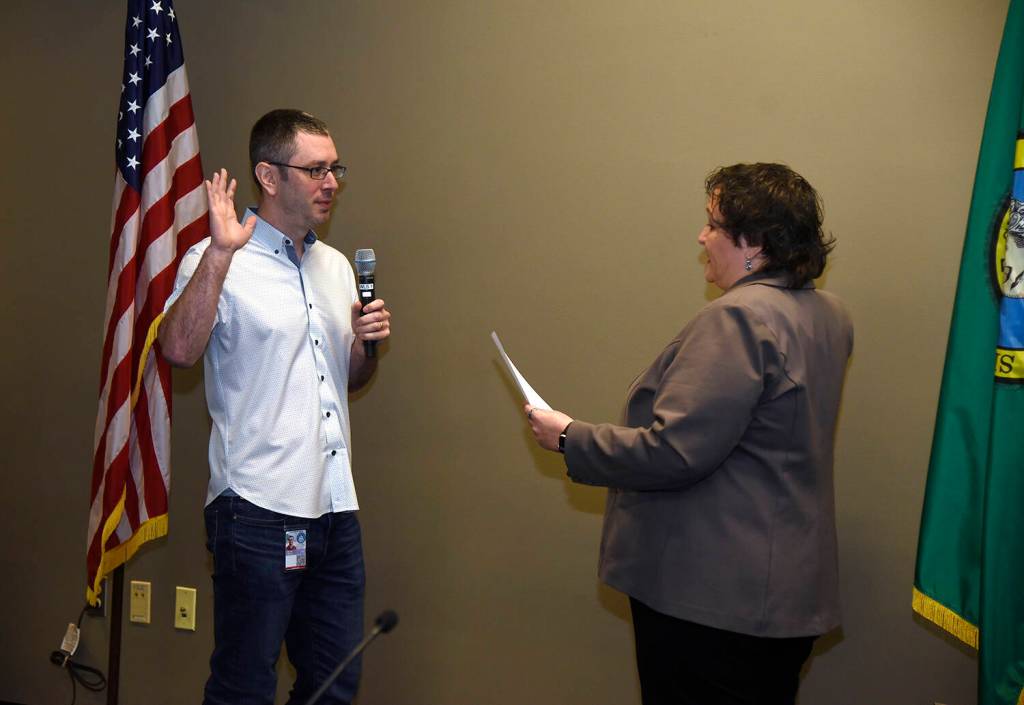 Mercer Island city clerk Andrea Larson swears in Daniel Becker to his deputy mayor position at the Jan. 6 meeting. Photo courtesy of the city of Mercer Island