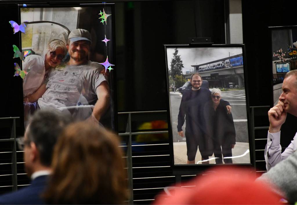 Geoff Graves, right, listens to a speaker at the memorial. Andy Nystrom/ staff photo