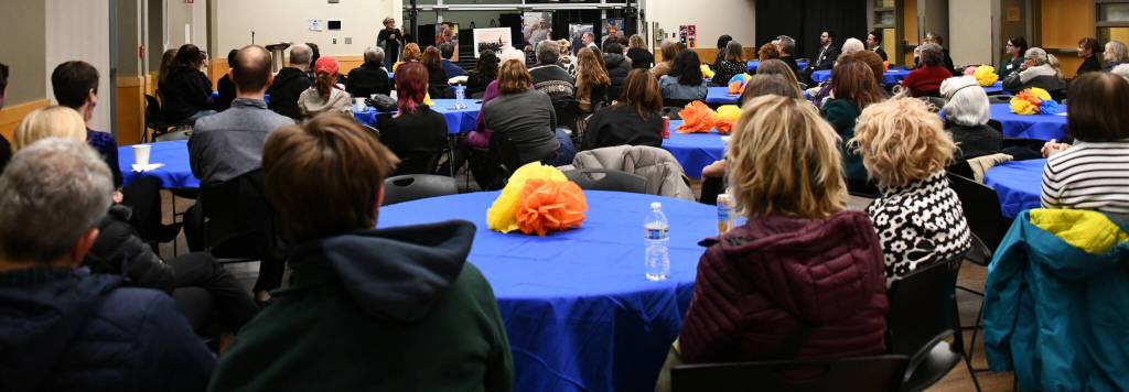 Memorial attendees listen to Sara Cobb speak. Andy Nystrom/ staff photo