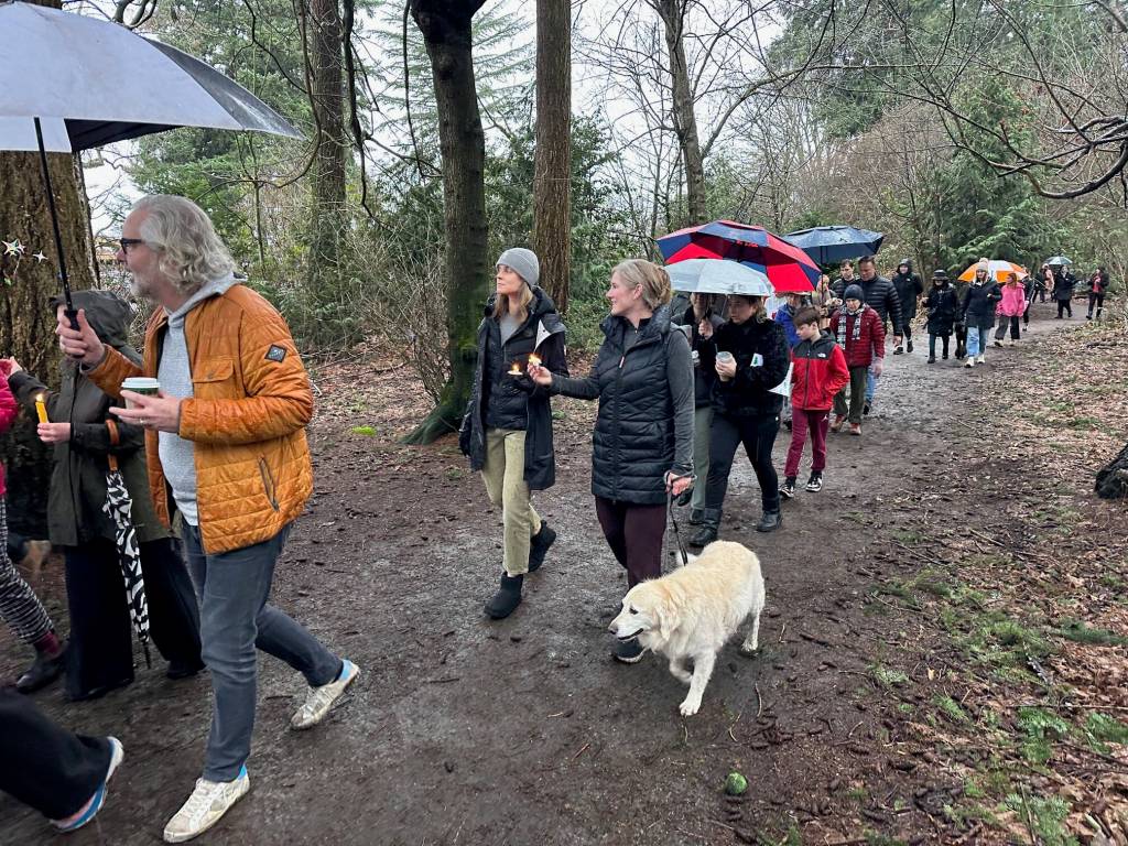 About 150 Mercer Islanders turned out in the rain on the afternoon of Jan. 4 in Pioneer Park for a candlelight vigil to honor the memory of Danielle Cuvillier and her son Nick. Photo courtesy of Greg Asimakoupoulos