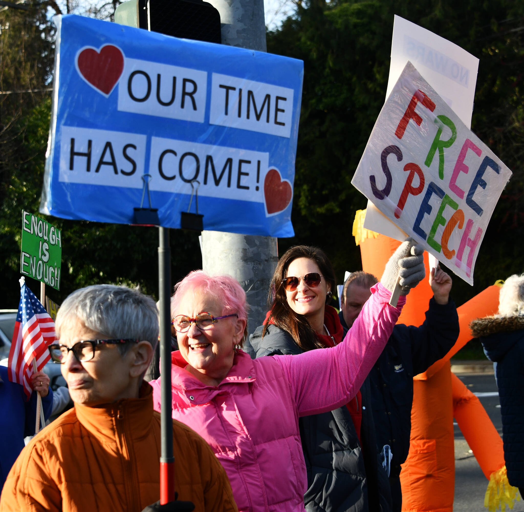Protesters speak out at the Mercer Island Walks for a Free America event on Jan. 20 at the intersection of Southeast 40th Street and Island Crest Way. Andy Nystrom/ staff photo
