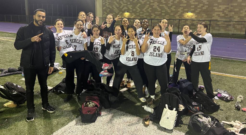 Mercer Island High Schools girls flag football squad is, front row, left to right: Head coach Victor Gamboa, Charlotte Arthur, Alexandra Arthur, Leah Zana, Imogen Logan, Chloe Yu and Elizabeth Turba; back row, left to right: Mackenzie Slivinski, Aimee Montpellier, Audrey Goodman, Suhavi Sidhu, Riley Dowdy, Joy Rurangwa, Stella Lanz, Megan Wong and Livi Rogers. Not pictured: Kristin Brintnall and Dani Wolfe. Courtesy photo