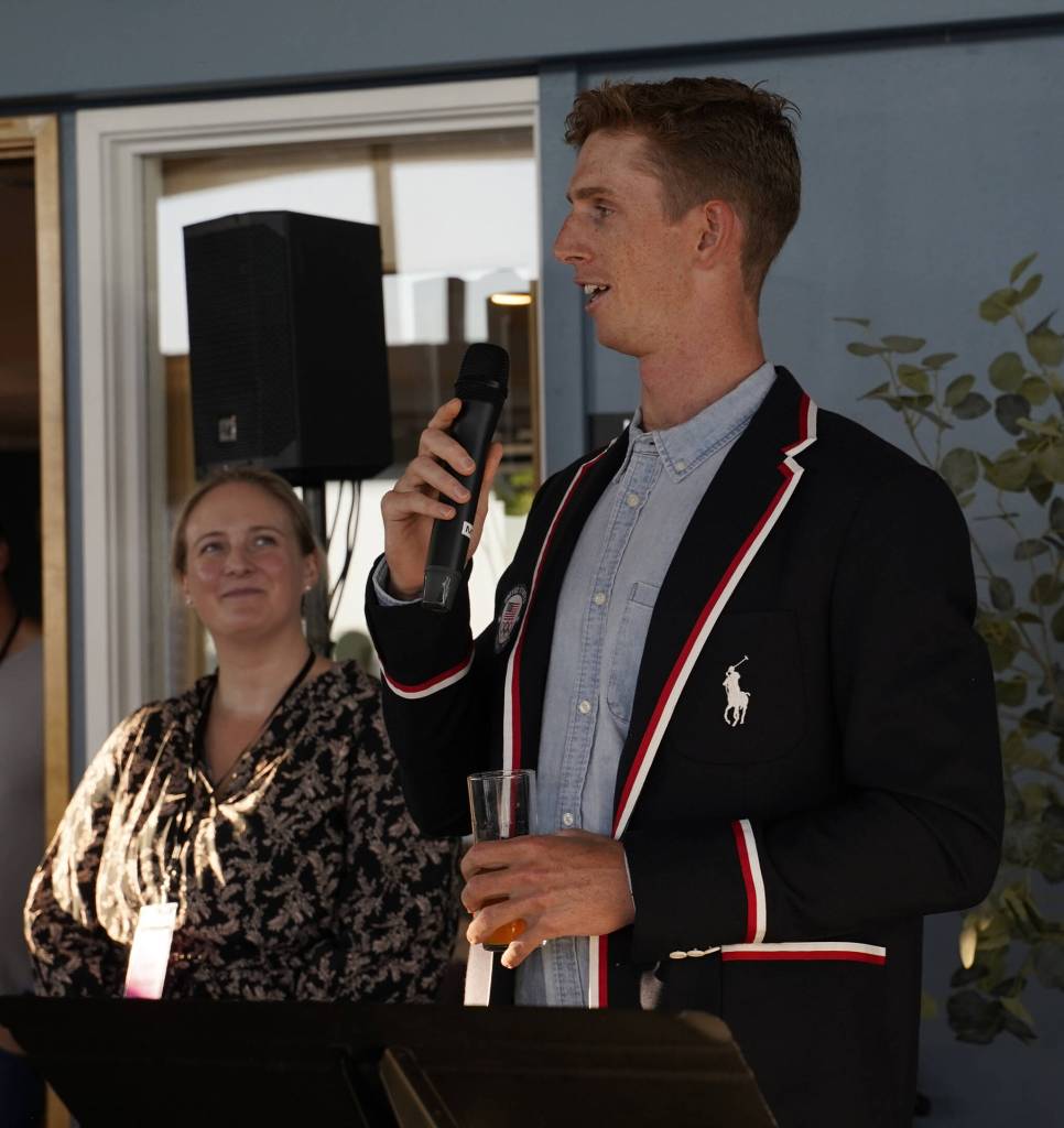 Pieter Quinton, a bronze medal-winner in the American mens eight at the 2024 Summer Olympics, speaks at the Mercer Island Rowing Clubs inaugural fundraiser on Oct. 5, 2025, at the Mercer Island Beach Club. Also pictured is Lauren Alexander, the clubs president and founder. Courtesy photo