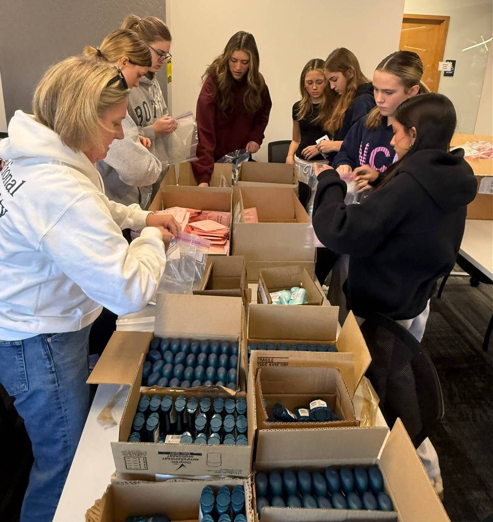 Mercer Island National Charity League members assemble coloring and activity kits for kids and hygiene kits for the American Red Cross Armed Forces program on Jan. 24. Photo courtesy of Katie Penny Shea