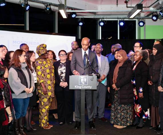 <p>King County Executive Girmay Zahilay, surrounded by community members, announces an executive order to protect immigrants at a press conference Feb. 12, 2026. Photo courtesy of King County Office of the Executive</p>