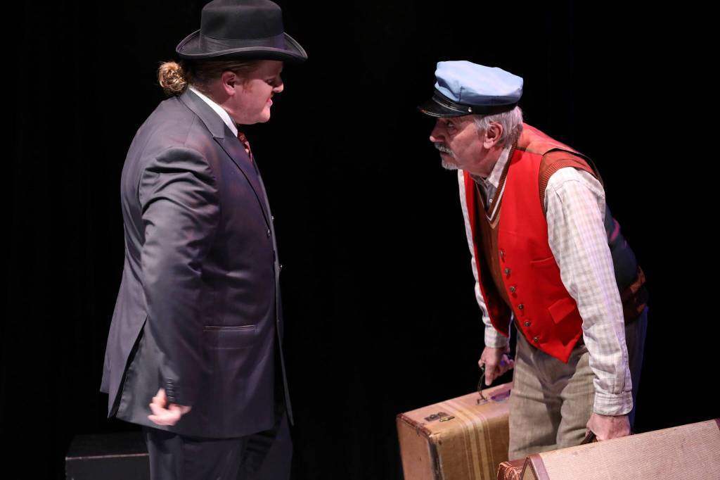 Photo by Allyson Meyer/Whidbey Island Center for the Arts. Miles Harrison, left, as Captain Hastings approaches Tony Salome in one of his many roles as the railway porter.