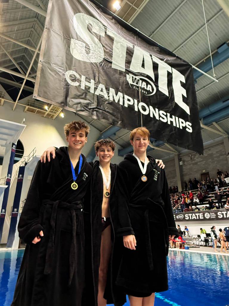 Photo courtesy of Kara Lucas
Mercer Island High Schools divers: Connor Carson (first), Asher Weeks (third) and Shane Kornblum (seventh) gather at the state meet.