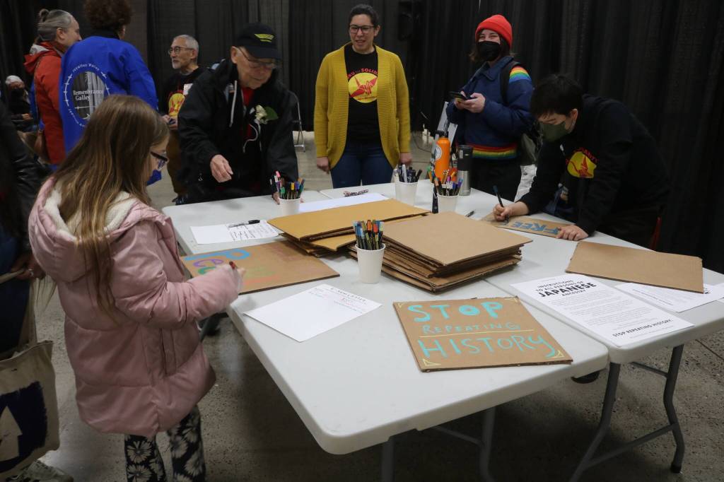 Participants make signs to bring to the Solidarity Day demonstration at the Northwest Detention Center in an event organized by Tsuru for Solidarity and La Resistencia. Photo by Bailey Jo Josie/Sound Publishing