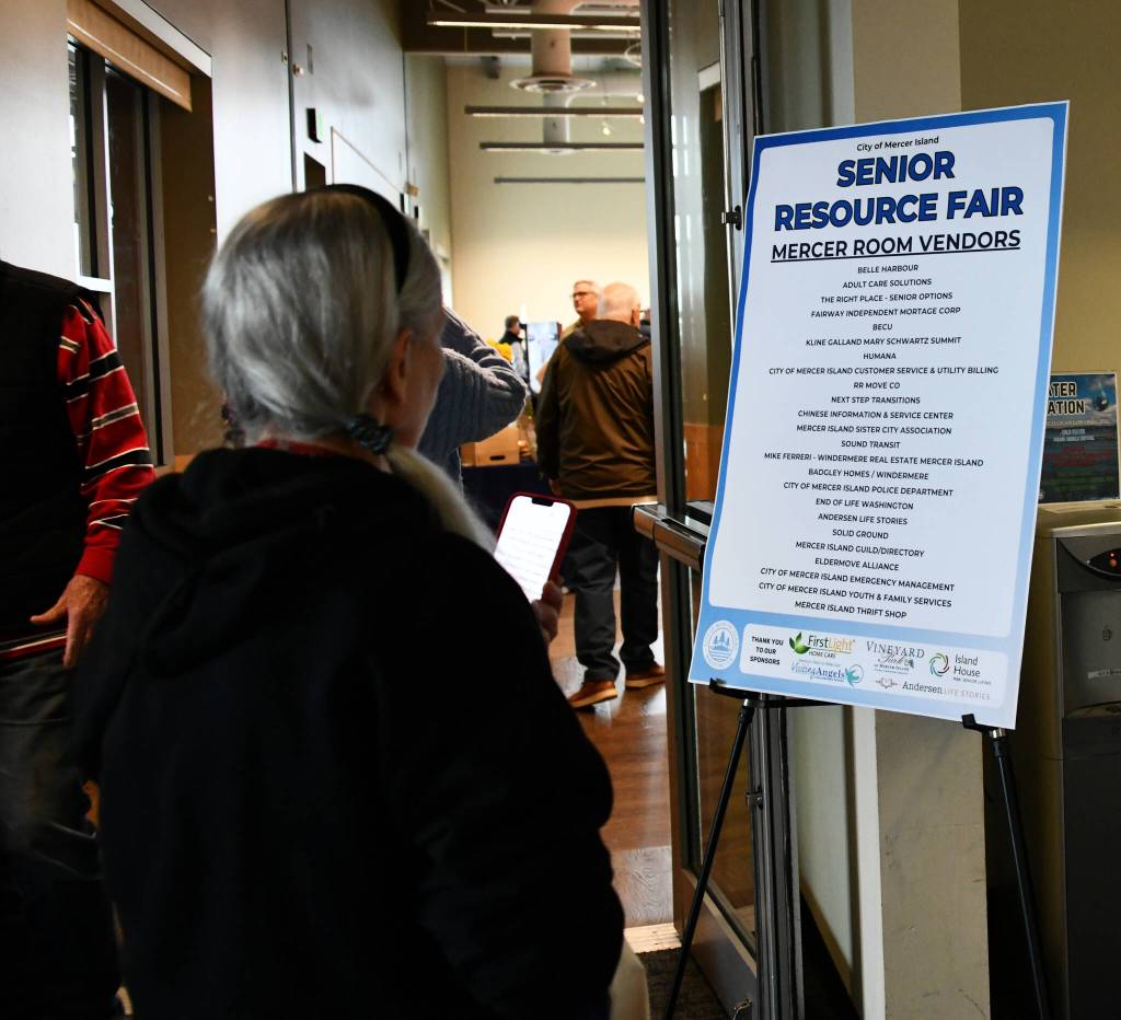 Checking out the booth lineup. Andy Nystrom/ staff photo