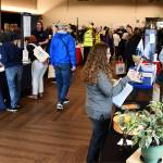Attendees visit a plethora of booths. Andy Nystrom/ staff photo