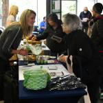 A discussion at the Vineyard Park assisted living booth. Andy Nystrom/ staff photo