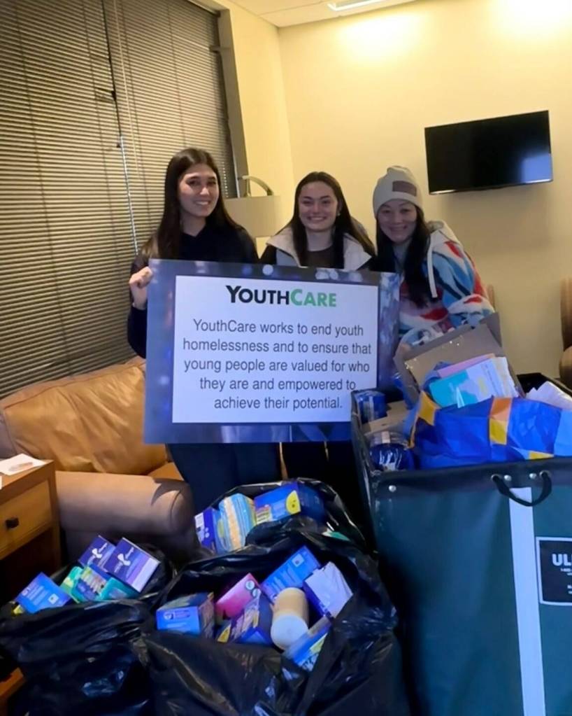 In February, thanks to the generosity of the community, The Maroon Project at Mercer Island High School donated more than 200 boxes of period products collected during its holiday drive. Co-presidents Jasmine Said and Jackie Gonzalez presented the donation to Jill Witsoe, development manager of annual giving at YouthCare, supporting the organizations work serving thousands of teens experiencing homelessness across Seattle each year. Photo courtesy of the Mercer Island School District