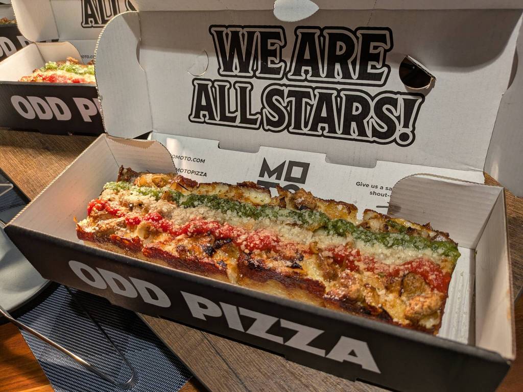 Moto Pizza Mr. Pig. Made with Filipino pork belly, spicy pork sausage, onion, Moto cheese blend, parmesan topped with tomato sauce, calamansi lime sauce and Mr. Pig sauce. Photo by Bailey Jo Josie/Sound Publishing.