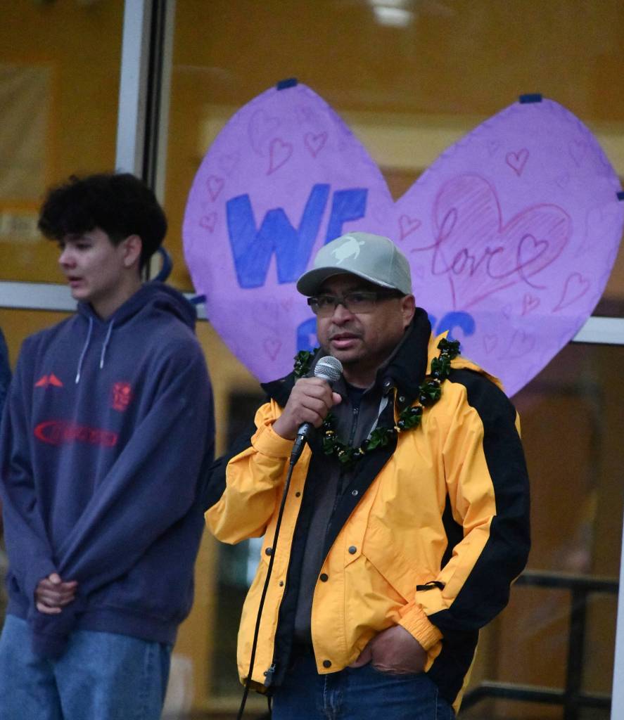 Jon Madamba speaks at a vigil for his son, Rhys, who passed away on March 14. The gathering was held on March 19 at the Mercer Island High School amphitheater. Also pictured is Rhyss best friend Louis Garry. Andy Nystrom/ staff photo