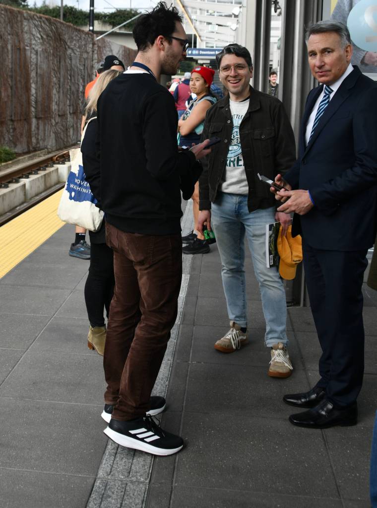 Sound Transit CEO Dow Constantine, right, stands on the Mercer Island Station deck. Andy Nystrom/ staff photo