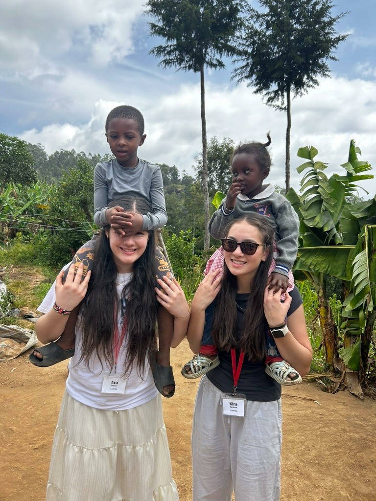 Photo courtesy of Kira Lackland
Ava Imbesi (left) and Kira Lackland (right) with Kiras pen pal Mercys sister and cousin.