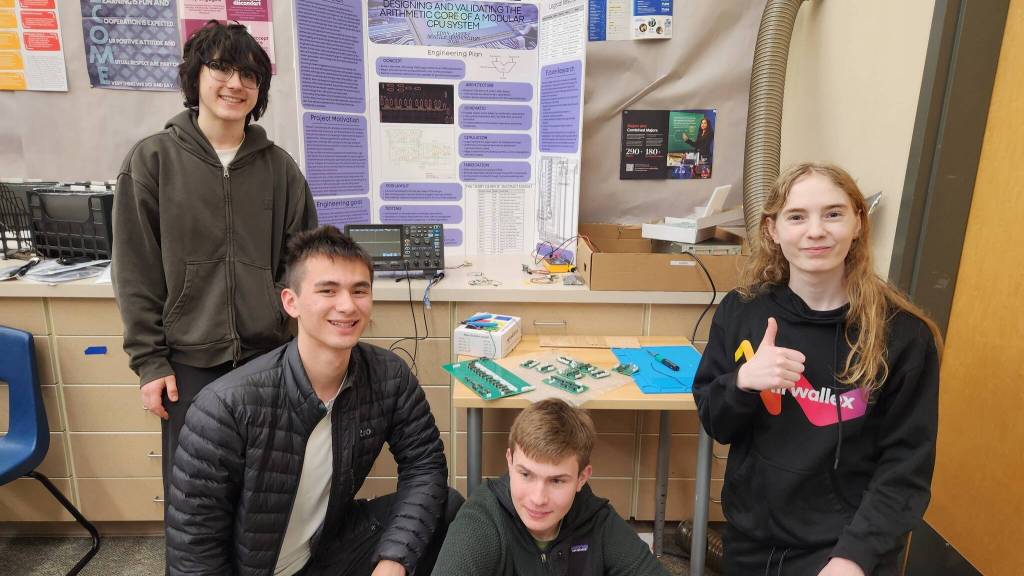 Mercer Island High School Advanced Programming (Course CSE, Computer Science and Engineering) students Gavrilo Odievich (top left), Derek Borden (bottom left), Derek Weiss (bottom) and Andrew Fateev (right) recently won the Award for Excellence in Engineering from the Society of Professional Engineering Employees in Aerospace (SPEEA) after entering their project in the Central Sound Regional Science and Engineering Fair. The title of their submission was Computing the Future: THE CPU. There was a record-breaking 384 projects submitted and 443 student participants in the fair, which was held on March 7 at Mountlake Terrace High School. SPEEA represents more than 17,000 aerospace professionals. Photo courtesy of the Mercer Island School District