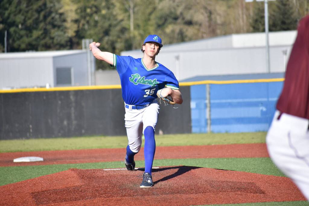 Tate Tuininga pitches for Liberty against Mercer Island. Ben Ray / The Reporter