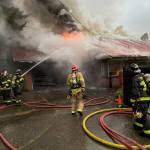 Firefighters work on extinguishing a two-alarm Mercer Island home blaze on April 14. Photo courtesy of Eastside Fire & Rescue