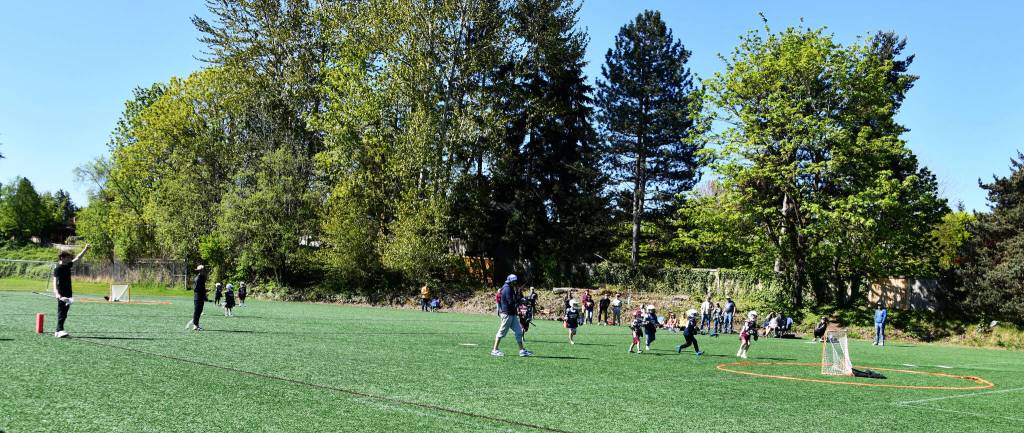 Youth lacrosse teams battle it out during a game on April 25 at the South Mercer Playfields. Andy Nystrom/ staff photo