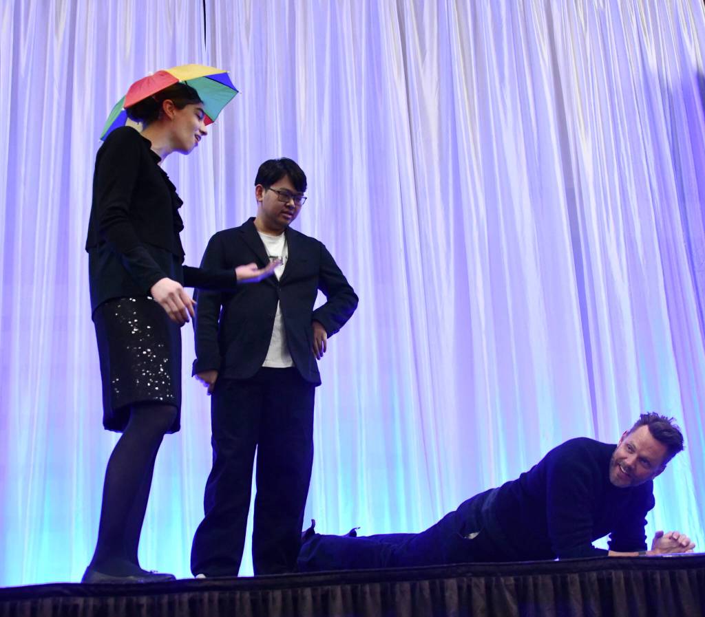 Joel McHale planks while Luthien Finch and Tiger Yang engage in improv. Andy Nystrom/ staff photo